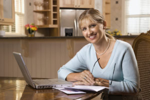 Woman Paying Bills On Laptop